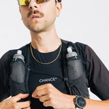 An ultra runner wears the Chance Ultra Tee in Black and Brown, with a white Chance logo mark on the chest.