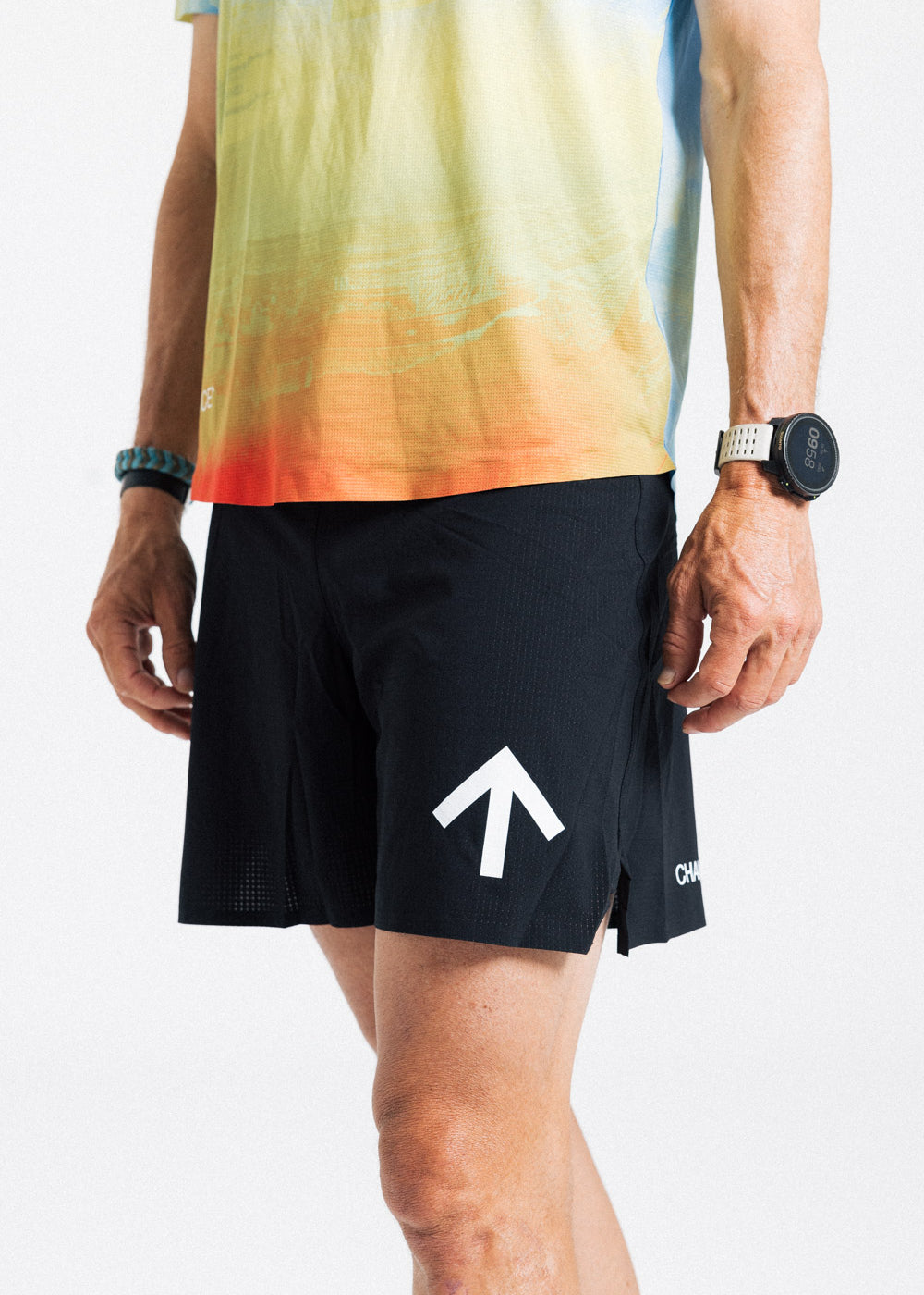 Close-up of the AROW Marathon Short v.2 in Black and White, showing the white arrow and Chance logo on the leg