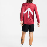 Back view of a male runner wearing the AROW Marathon Short v.2 in Black and Black with a red long sleeve top