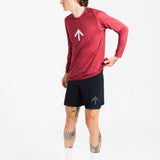 Male runner wearing the AROW Marathon Short v.2 in Black and Black with a red long sleeve top