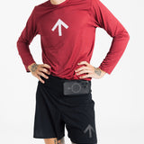 Male runner with hands on hips, a phone in the front waistband pocket of the AROW Marathon Short v.2 in Black and Black